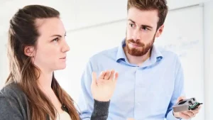 Two scientists discussing manufacturing