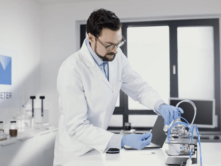 A photograph of a researcher working in a lab